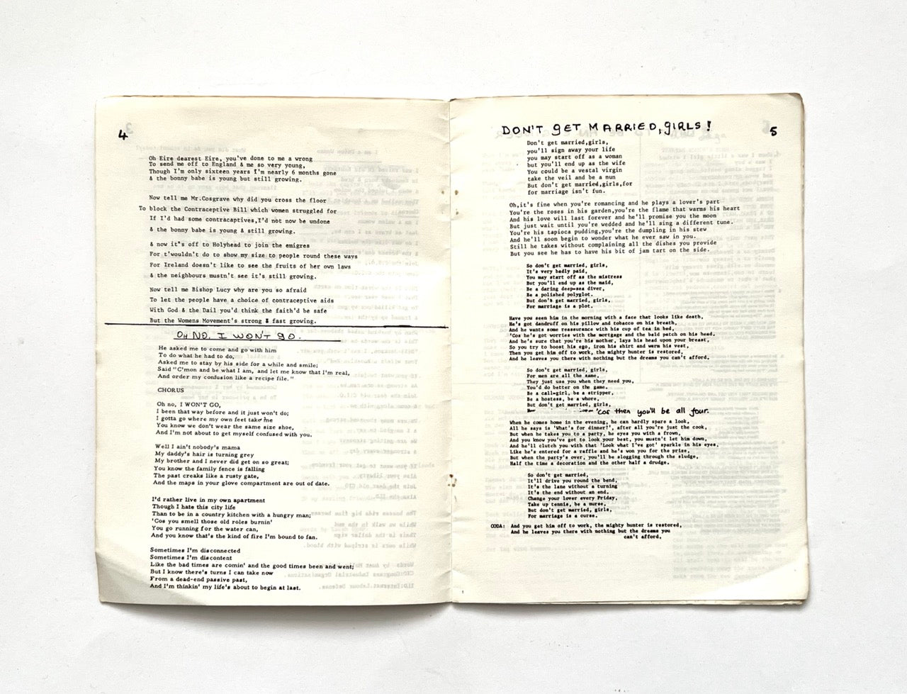 Open 1977 Women's Liberation Conference songbook with two pages of song lyrics.