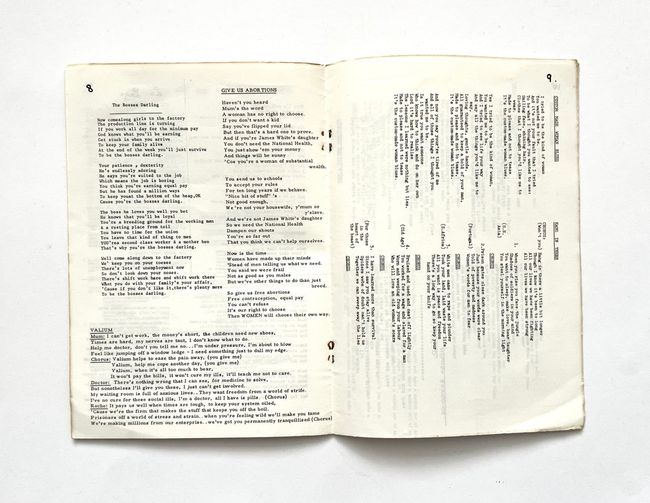 Open 1977 Women's Liberation Conference songbook with two pages of song lyrics.