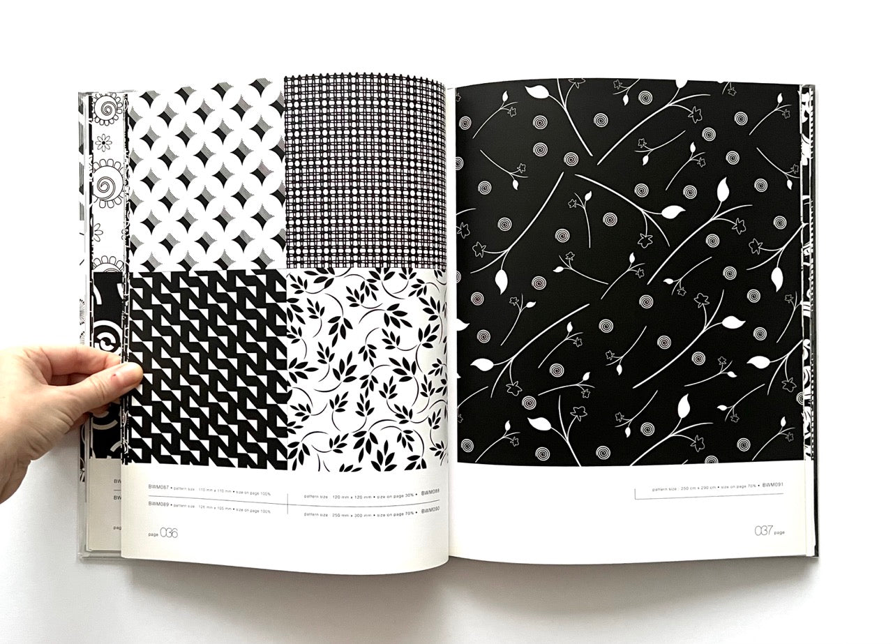 Open 'Black & White Matrix 1' book displaying black and white geometric and nature-inspired patterns.
