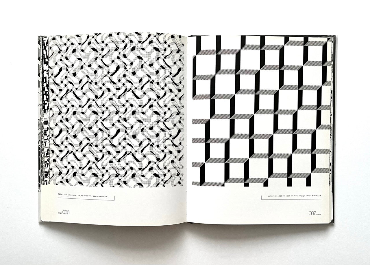 Open 'Black & White Matrix 1' book displaying black and white geometric patterns.