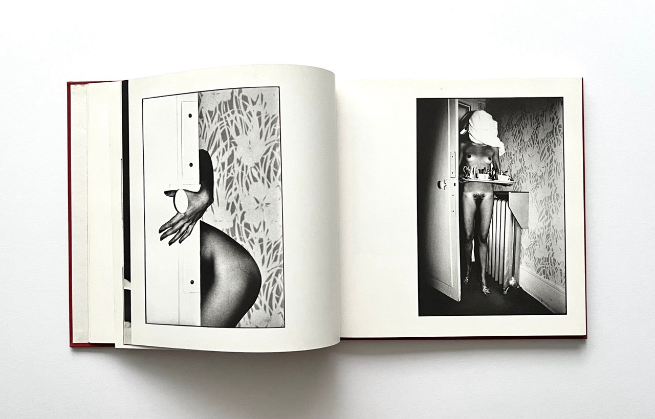 Open David Bailey's Trouble and Strife' book with a black and white photographs of nude Marie Helvin.