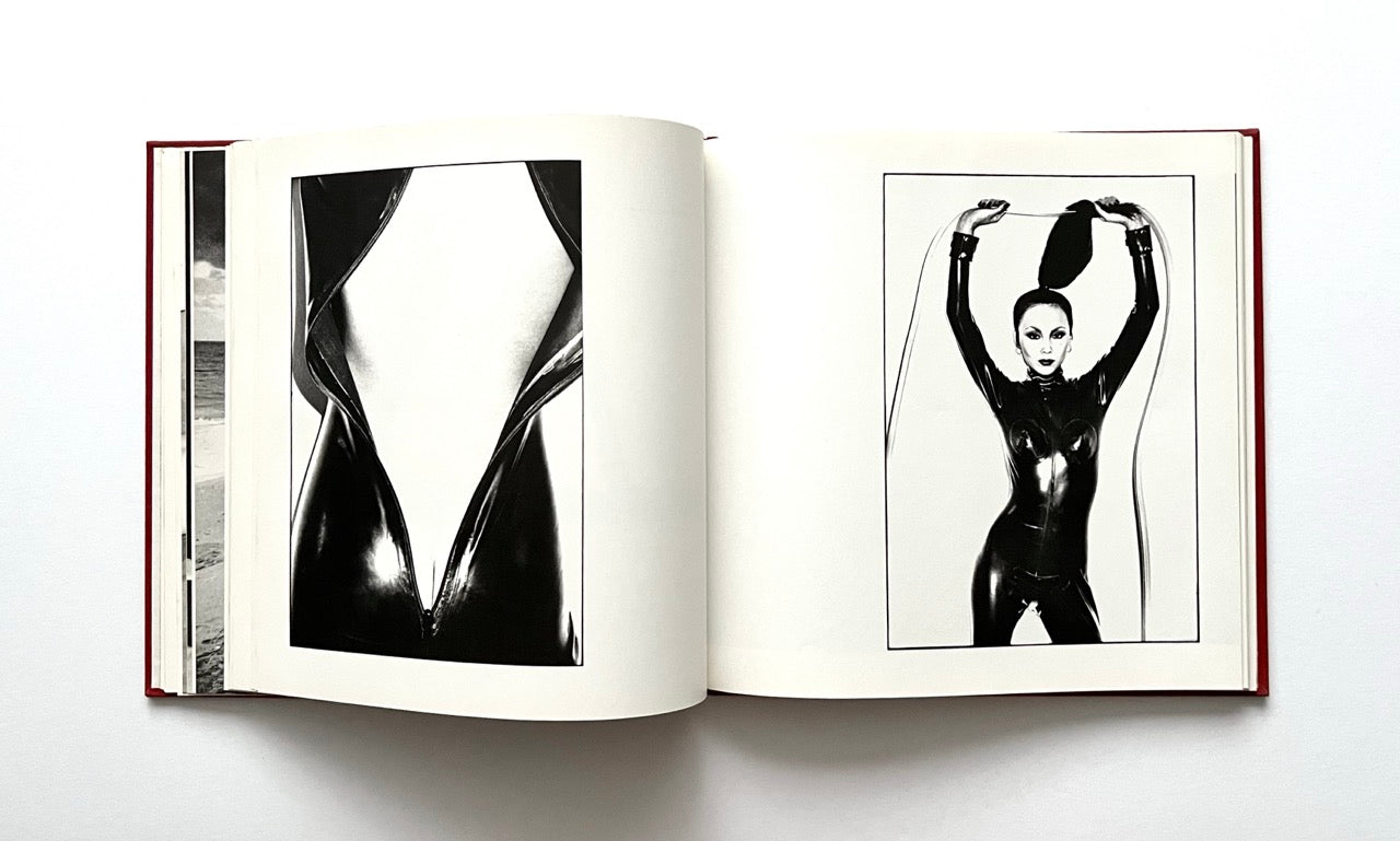 Open David Bailey's Trouble and Strife' book with black and white photographs of Marie Helvin in shiny black catsuit.