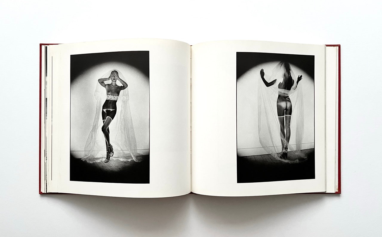 Open David Bailey's Trouble and Strife' book with black and white photographs of nude Marie Helvin.