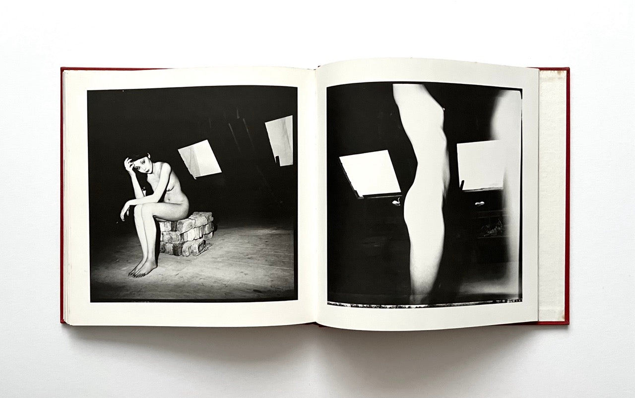 Open David Bailey's Trouble and Strife' book with black and white photographs of nude Marie Helvin.