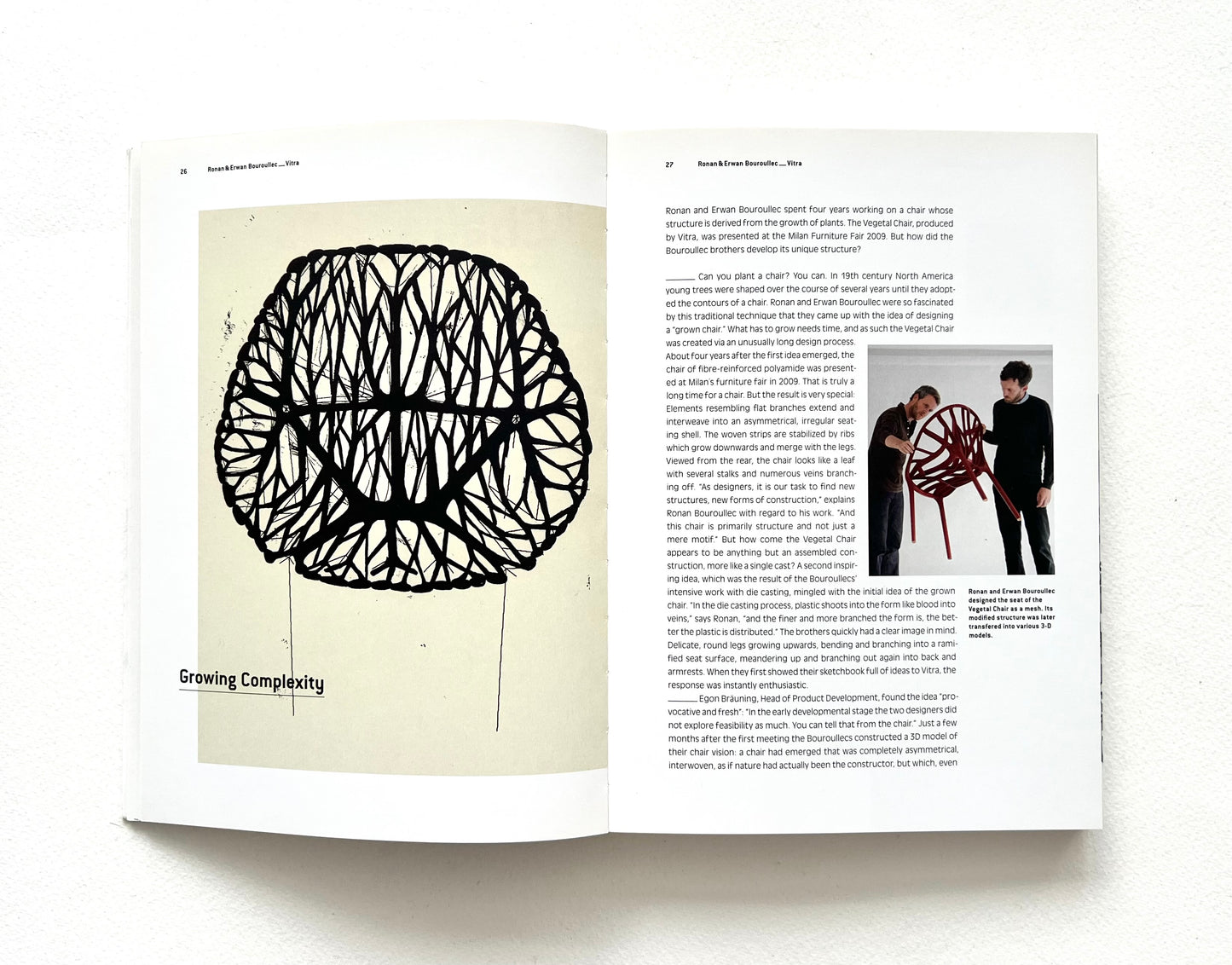 Open book with a black and white illustration on one page and text on the other, featuring a contamporary organic chair design.