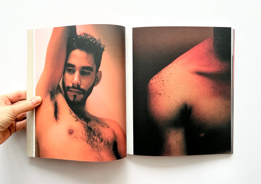 Open book - 'Port Yarin' by Jeff Hahn - showing a close-up of a man's shoulder with visible tattoos.