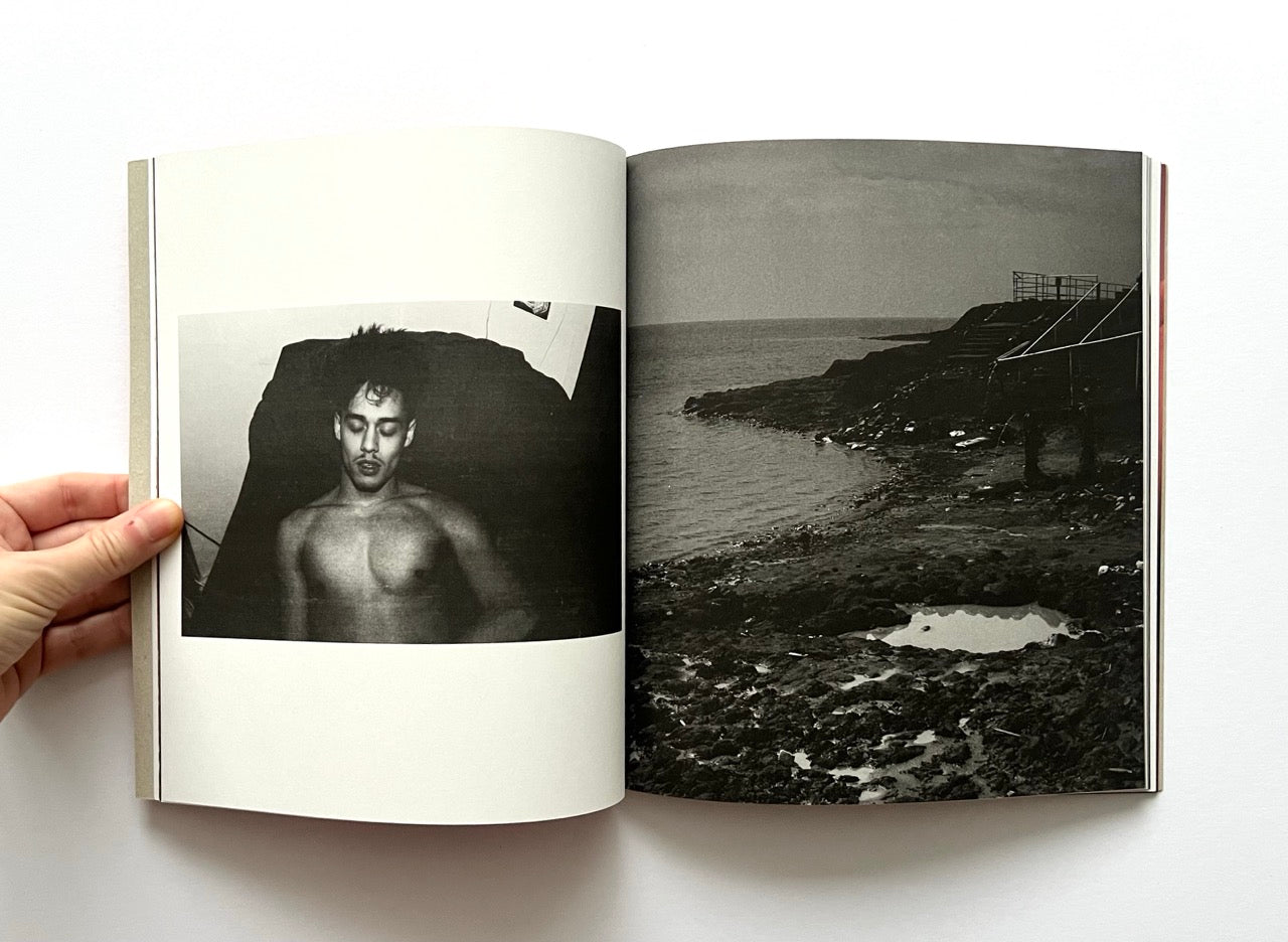 Open book - 'Port Yarin' by Jeff Hahn - showing a black and white photograph of a person and a coastal landscape.