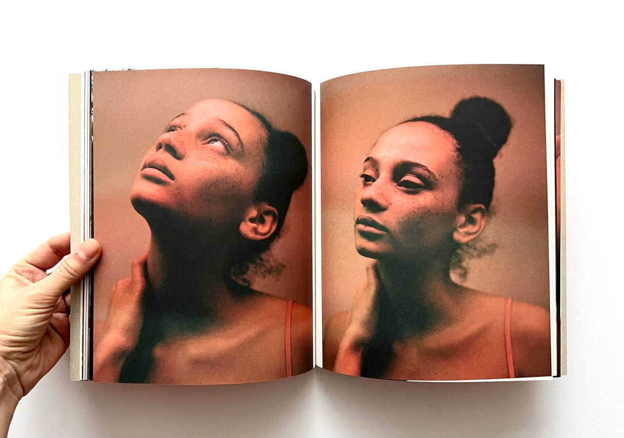 Open book - 'Port Yarin' by Jeff Hahn - showing two portraits of a woman with a neutral background