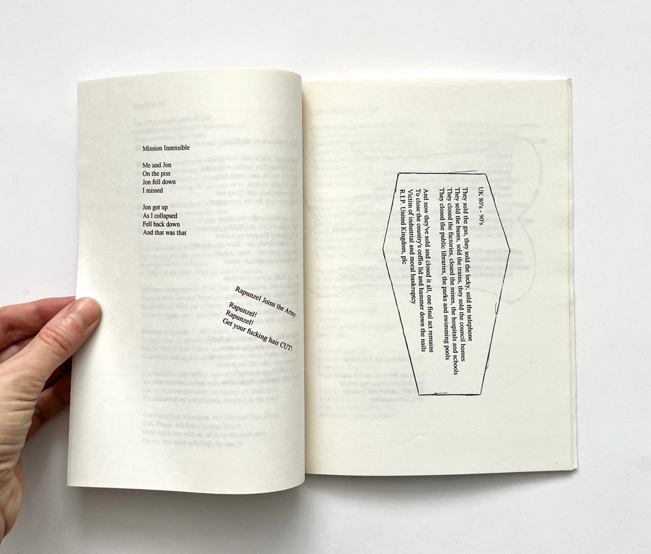 Open book ('JOHN LENNON NEVER LIVED IN OUR HOUSE' by RICHARD ALLEN) with printed text and a geometric shape on a white background