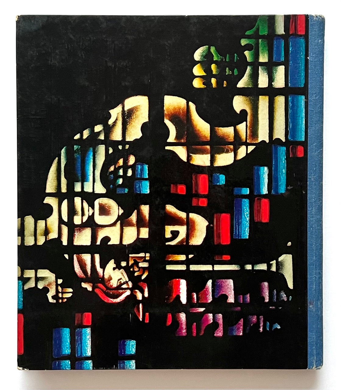 Book cover with abstract design featuring colorful geometric patterns on a black background