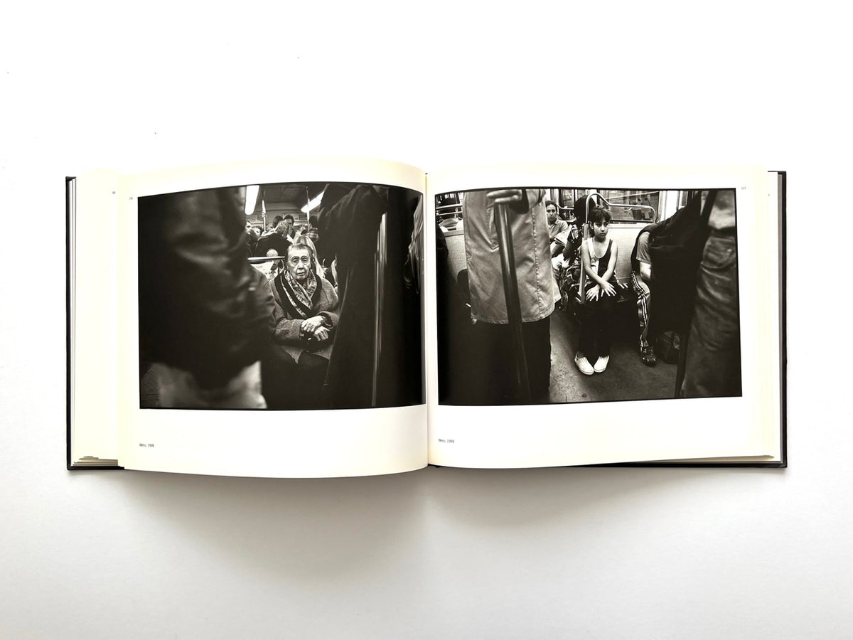 Interior spread from Parisians by Peter Turnley, published in 2000, featuring black-and-white documentary photographs of passengers travelling on the Paris Métro.