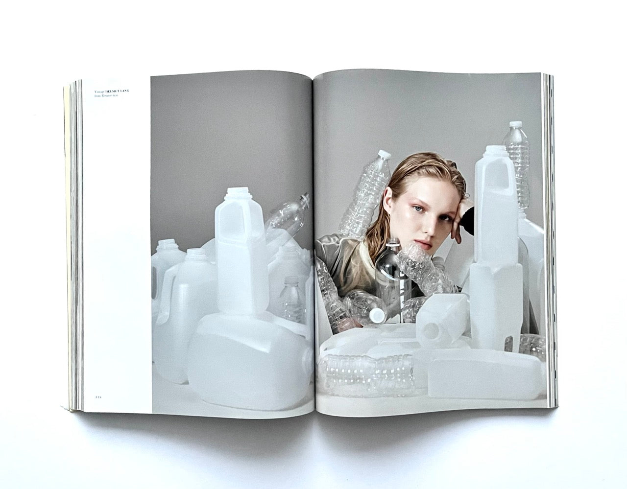 Open magazine - THE BEAUTIFUL HOME OF BUFFALO ZINE – ISSUE 6 (AW2017) -showing a photograph of a woman surrounded by white plastic bottles.