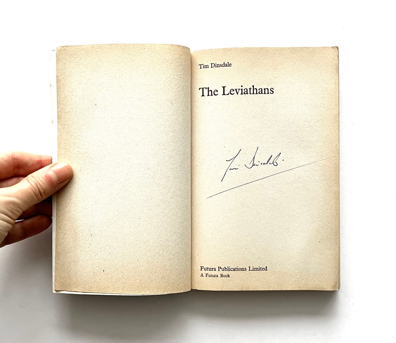 Open book titled 'The Leviathans' bearting a signature of the author, Tim Dinsdale.