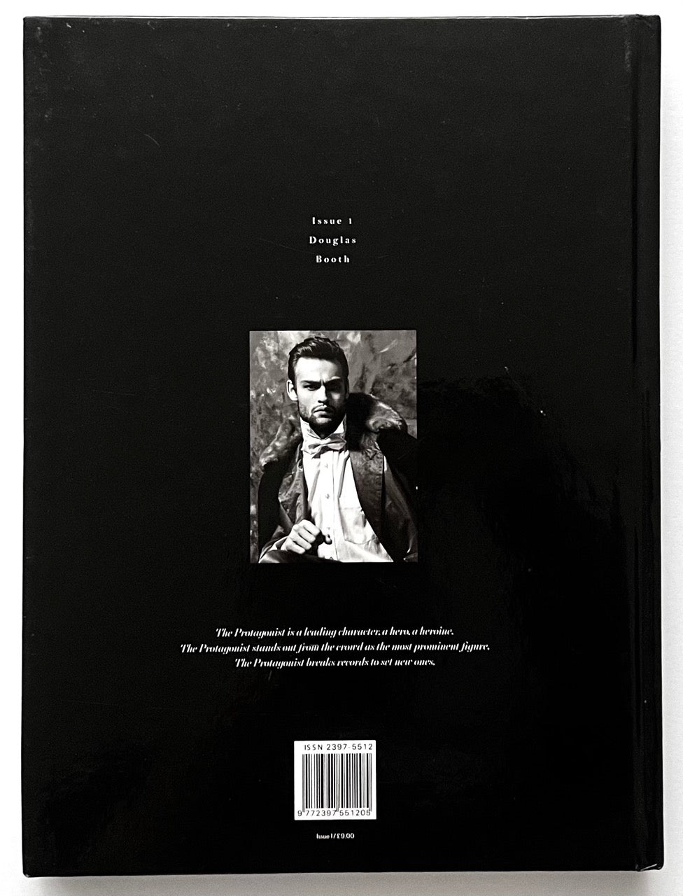 Back cover of 'The Protagonist Magazine' issue 1, with a small black and white portrait of Douglas Booth in the centre and text on a black background