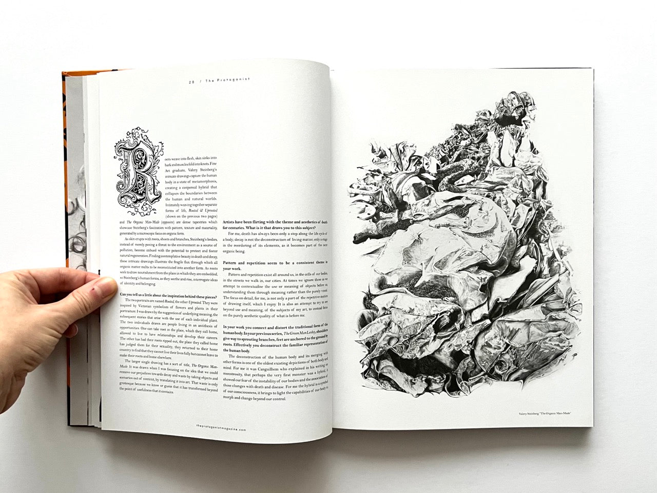 Open 'The Protagonist Magazine' issue 1, with black and white illustrations on a white background