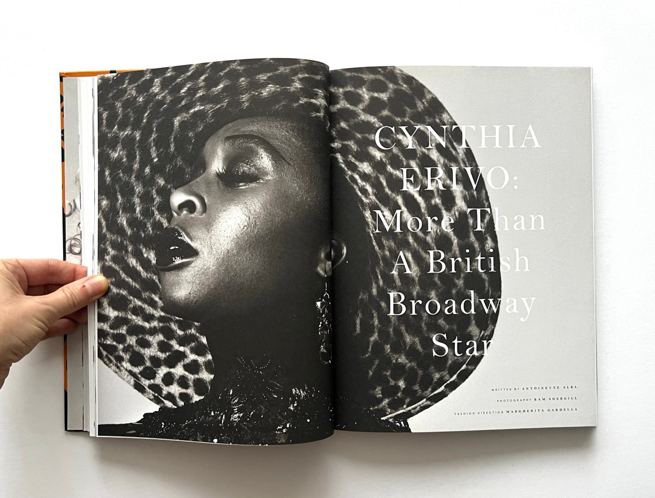 Open 'The Protagonist Magazine' issue 1, showing a black and white portrait of Cynthia Erivo in animal print hat.