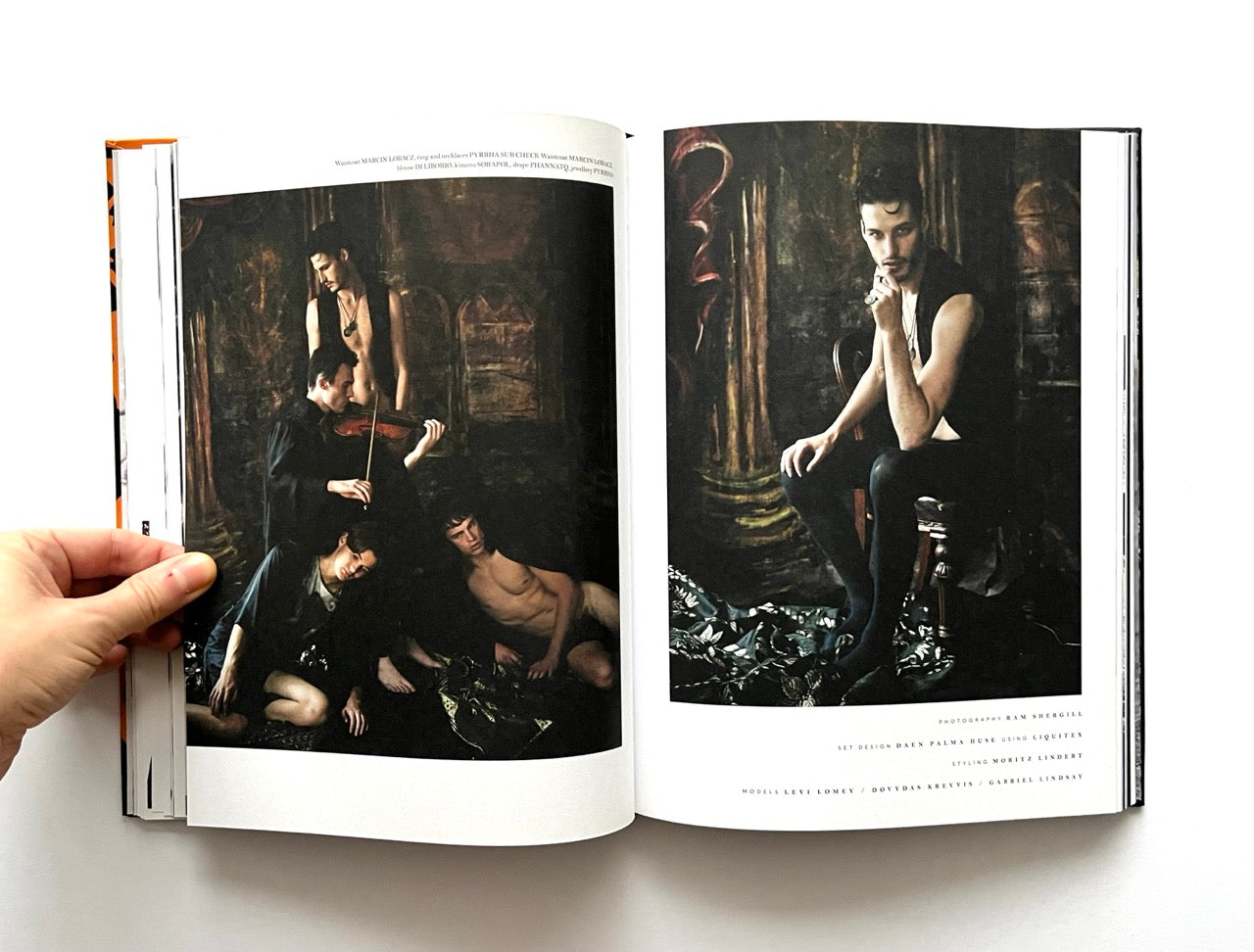 Open 'The Protagonist Magazine' issue 1, showing photographs of people in a dark, moody setting.