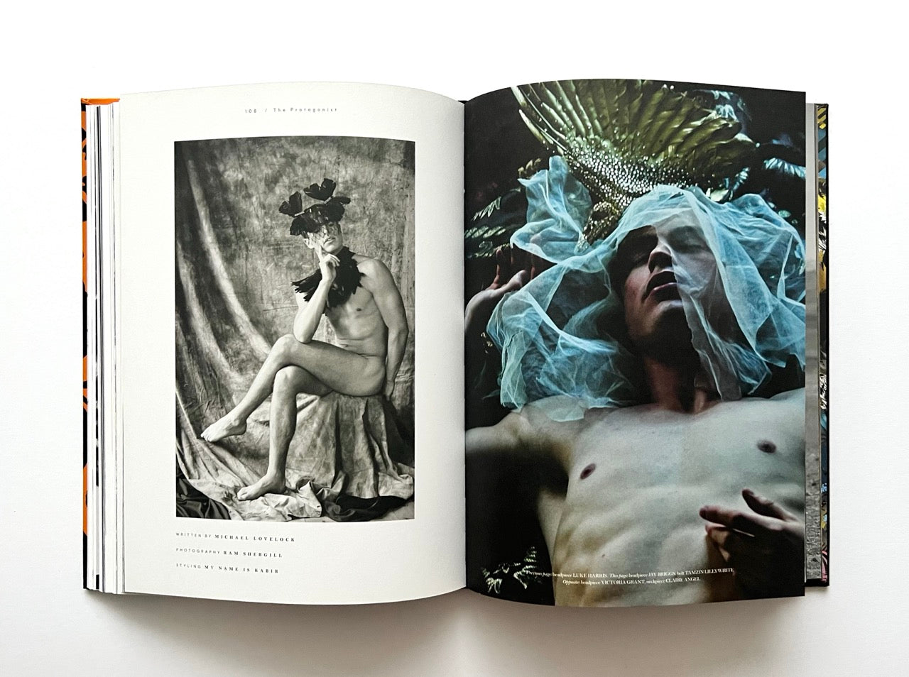 Open 'The Protagonist Magazine' issue 1, displaying artistic portraits of nude men with decorative elements.