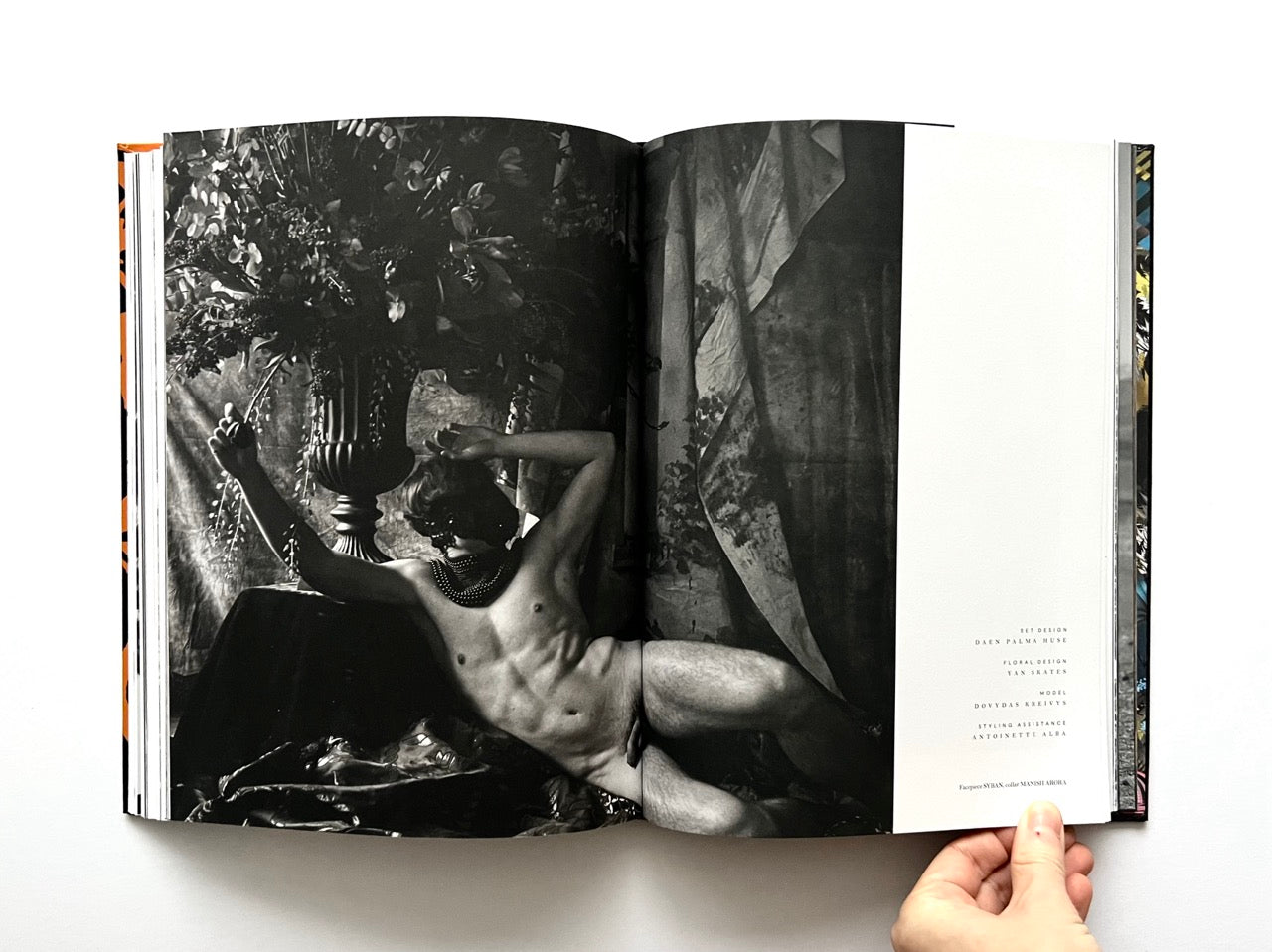 Open 'The Protagonist Magazine' issue 1, displaying a black and white photograph of a nude man against a textured wall.