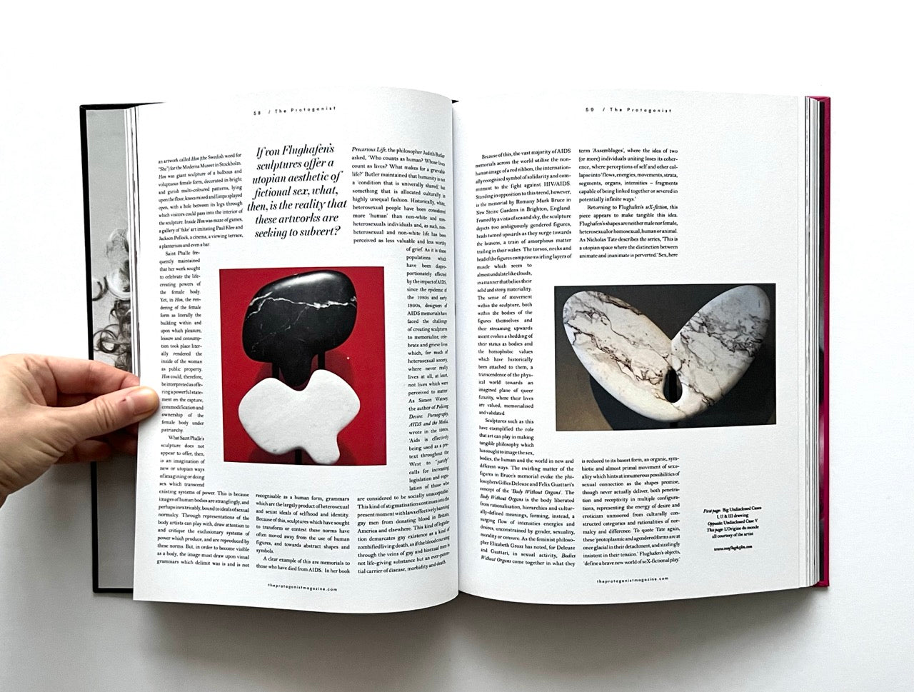 Open 'The Protagonist Magazine' issue 2, with images of stones on a white background
