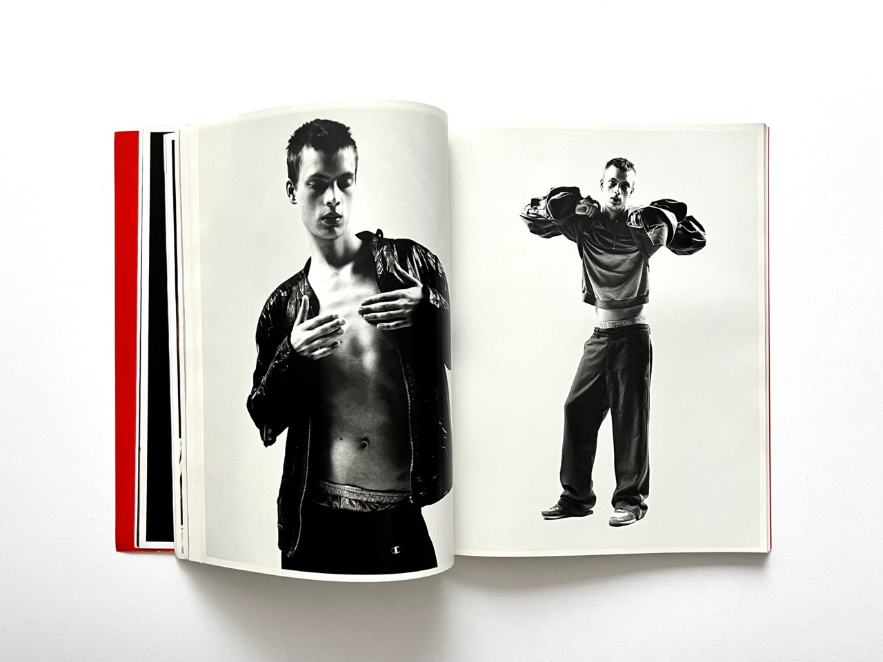 Interior spread of 10 Magazine Issue One showing two black and white portraits of male models in casual clothing