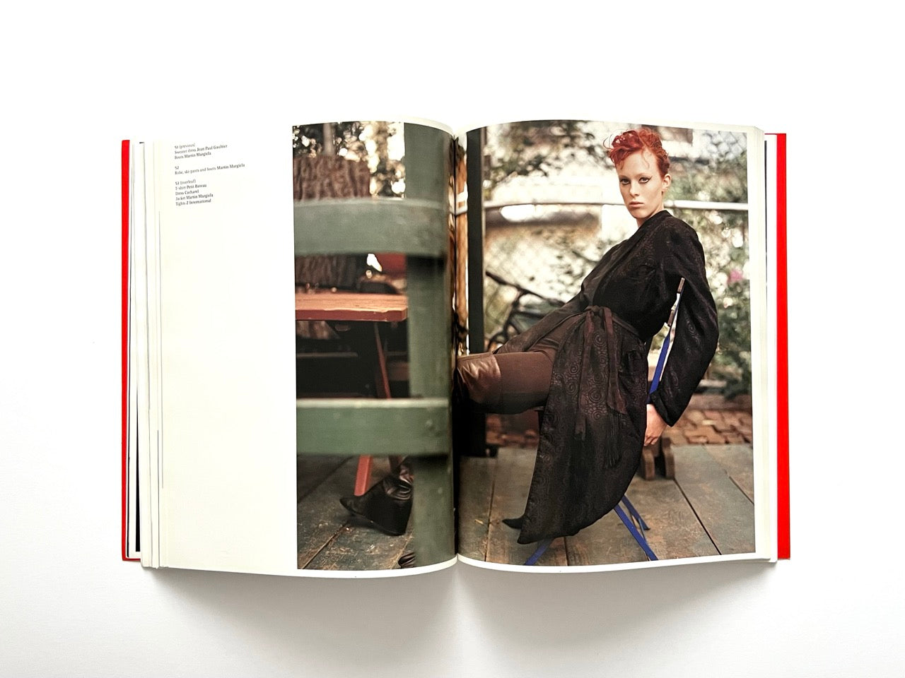 Interior spread of 10 Magazine Issue One showing a model seated outdoors in a dark outfit within a garden setting