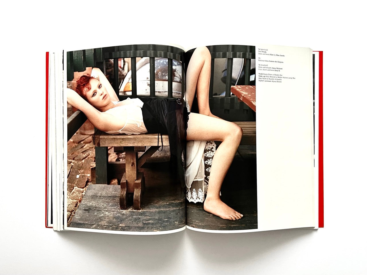 Interior spread of 10 Magazine Issue One featuring a model reclining across wooden benches in a stylised outdoor setting