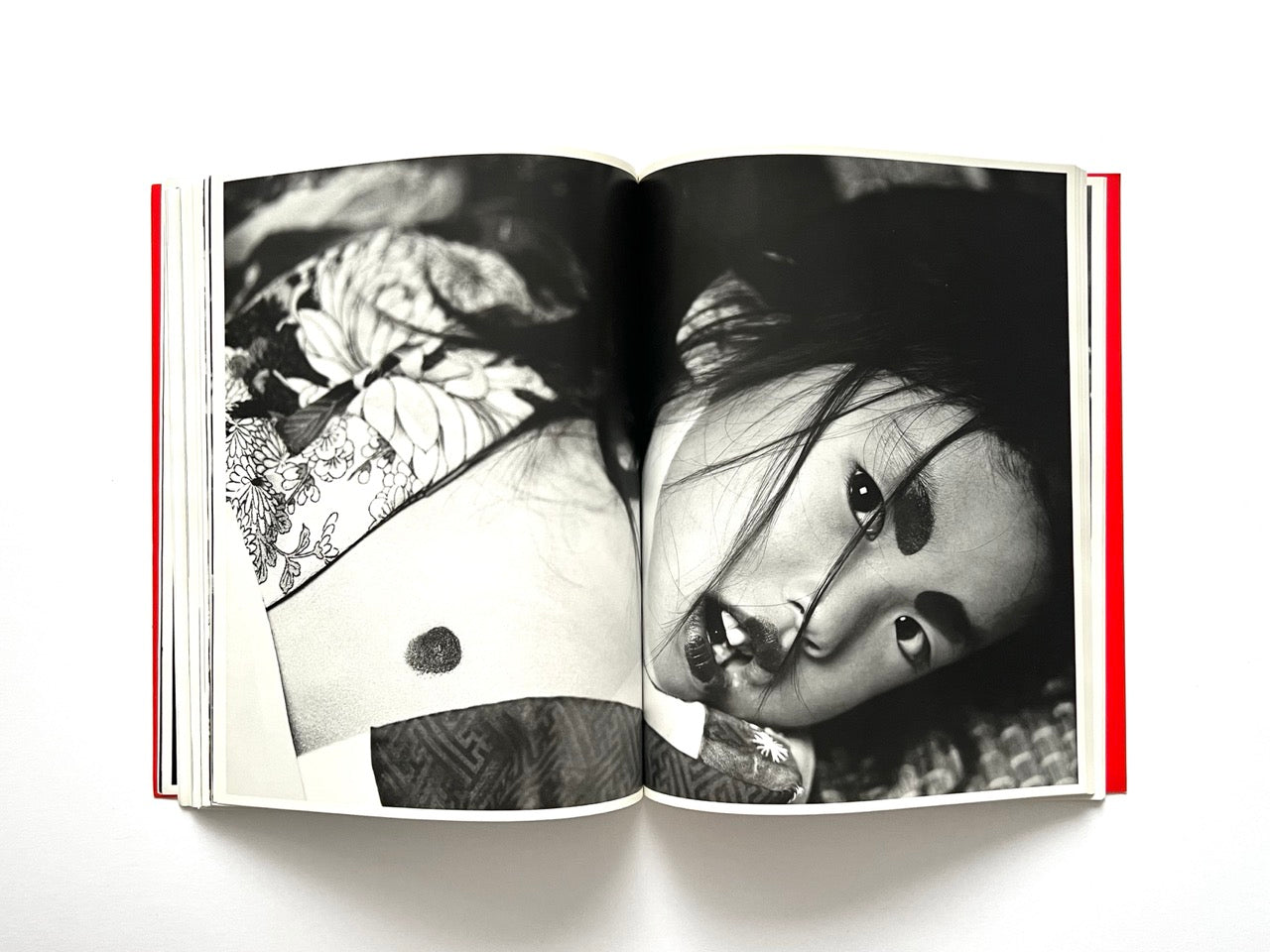 Interior spread of 10 Magazine Issue One showing a close-up black and white portrait of an asian model lying down