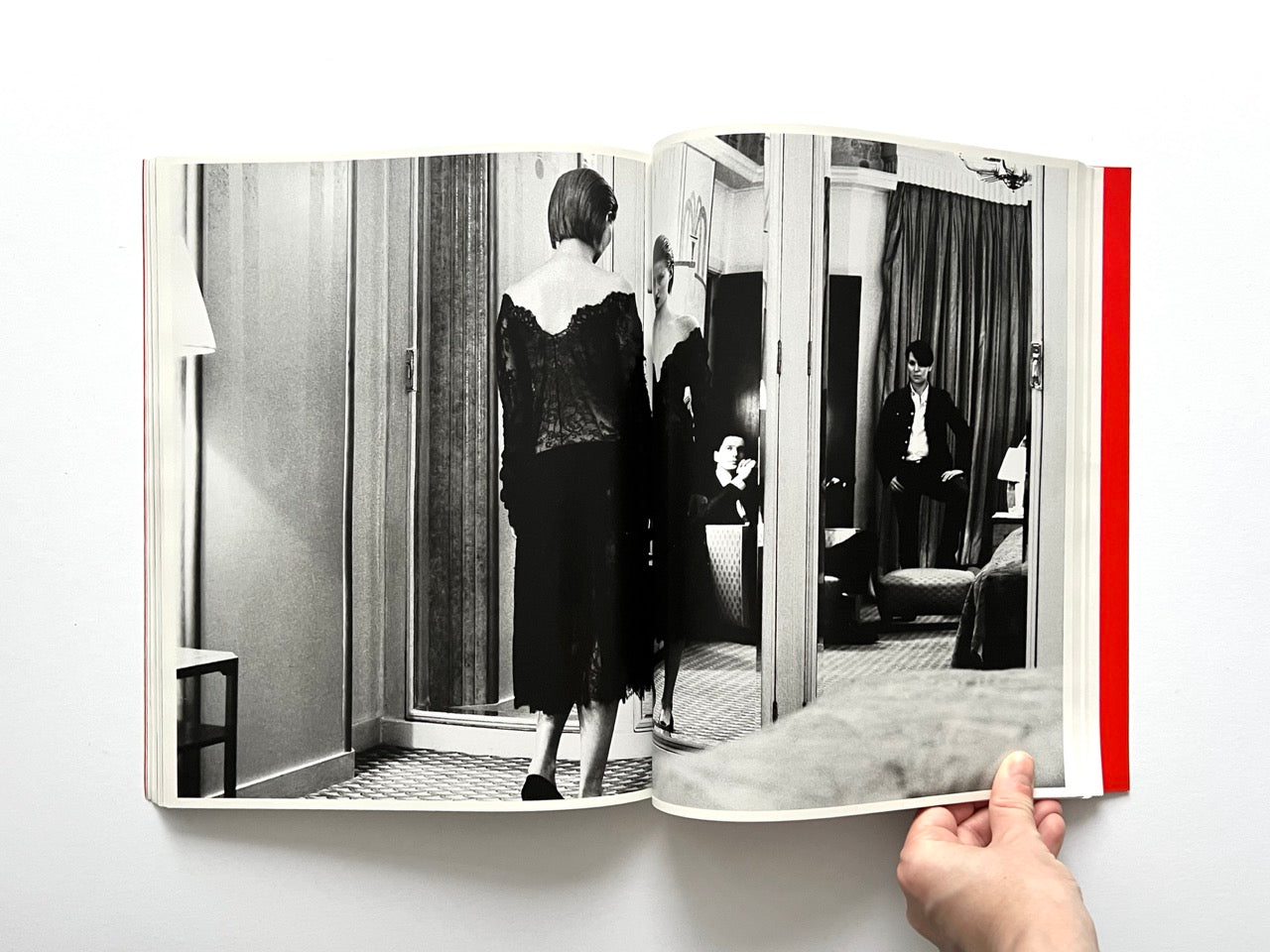 Interior spread of 10 Magazine Issue One featuring a black and white fashion scene with a model reflected in mirrors and a seated figure in the background