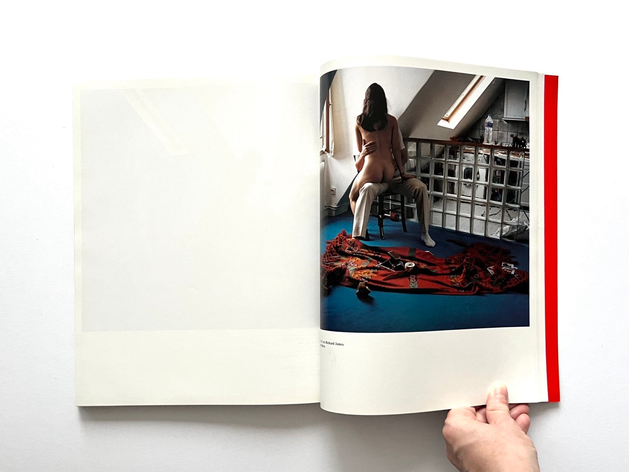 Interior spread of 10 Magazine Issue One featuring a nude female model seated on a dressed male model in a domestic space with a glass block wall