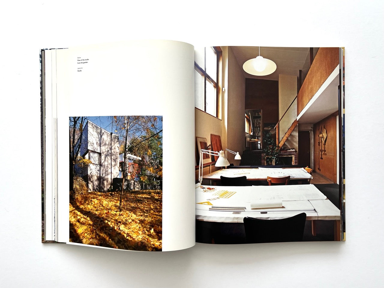 Interior spread from Alvar Aalto Houses (2011) by Jari Jetsonen and Sirkkaliisa Jetsonen, showing the exterior of the Aalto studio and its spacious double-height drawing studio with worktables.