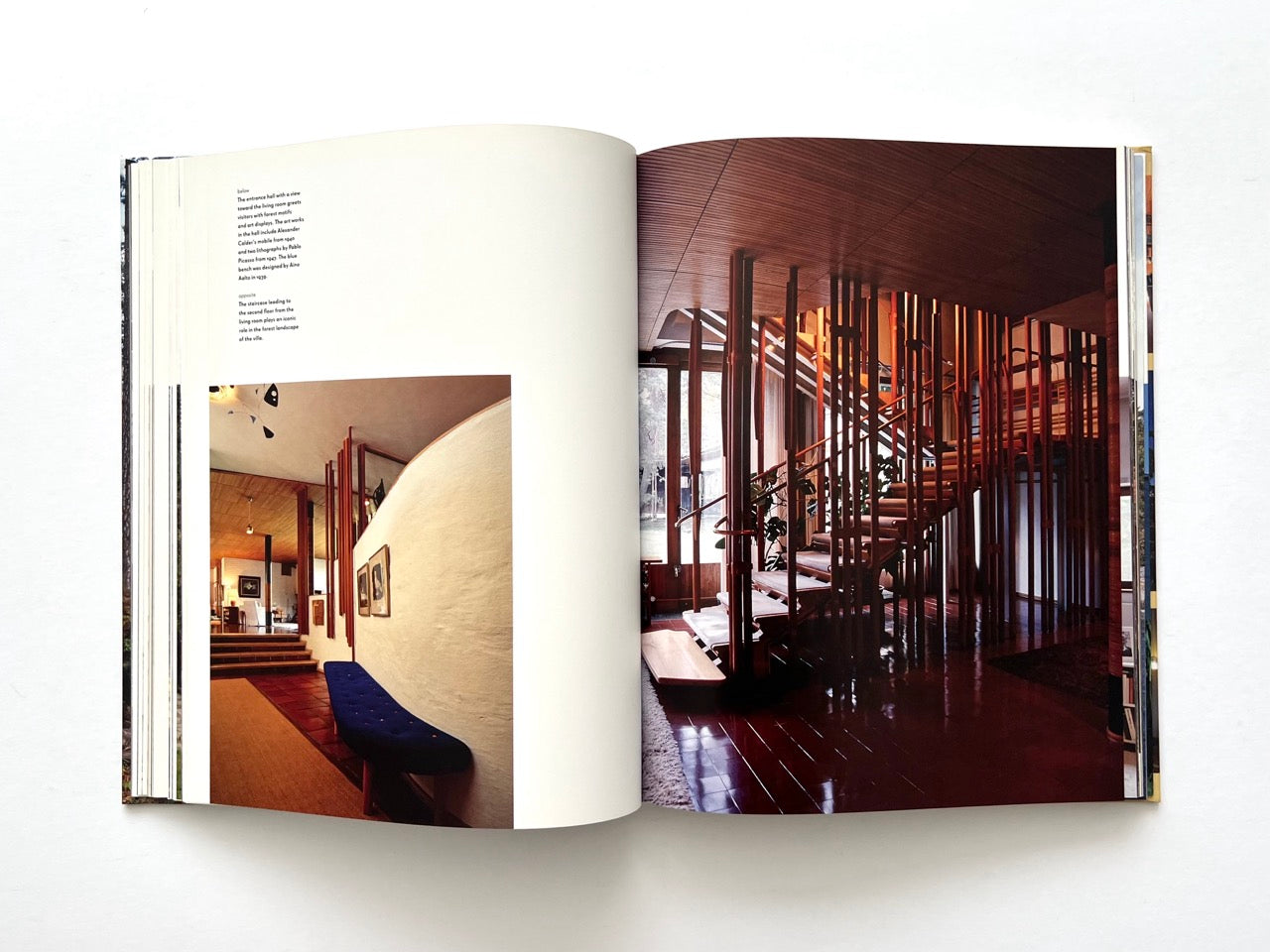 Interior spread from Alvar Aalto Houses (2011) by Jari Jetsonen and Sirkkaliisa Jetsonen, featuring the sculptural timber staircase, curved walls and warm modernist interiors of Villa Mairea.