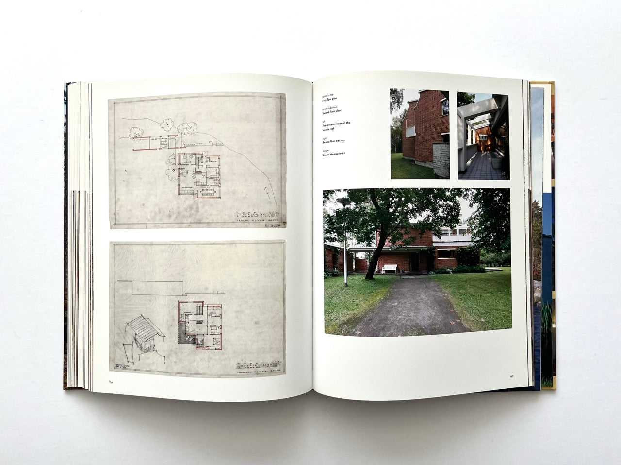 Interior spread from Alvar Aalto Houses (2011) by Jari Jetsonen and Sirkkaliisa Jetsonen, showing original architectural plans alongside exterior photographs of a brick Alvar Aalto house and its entrance.