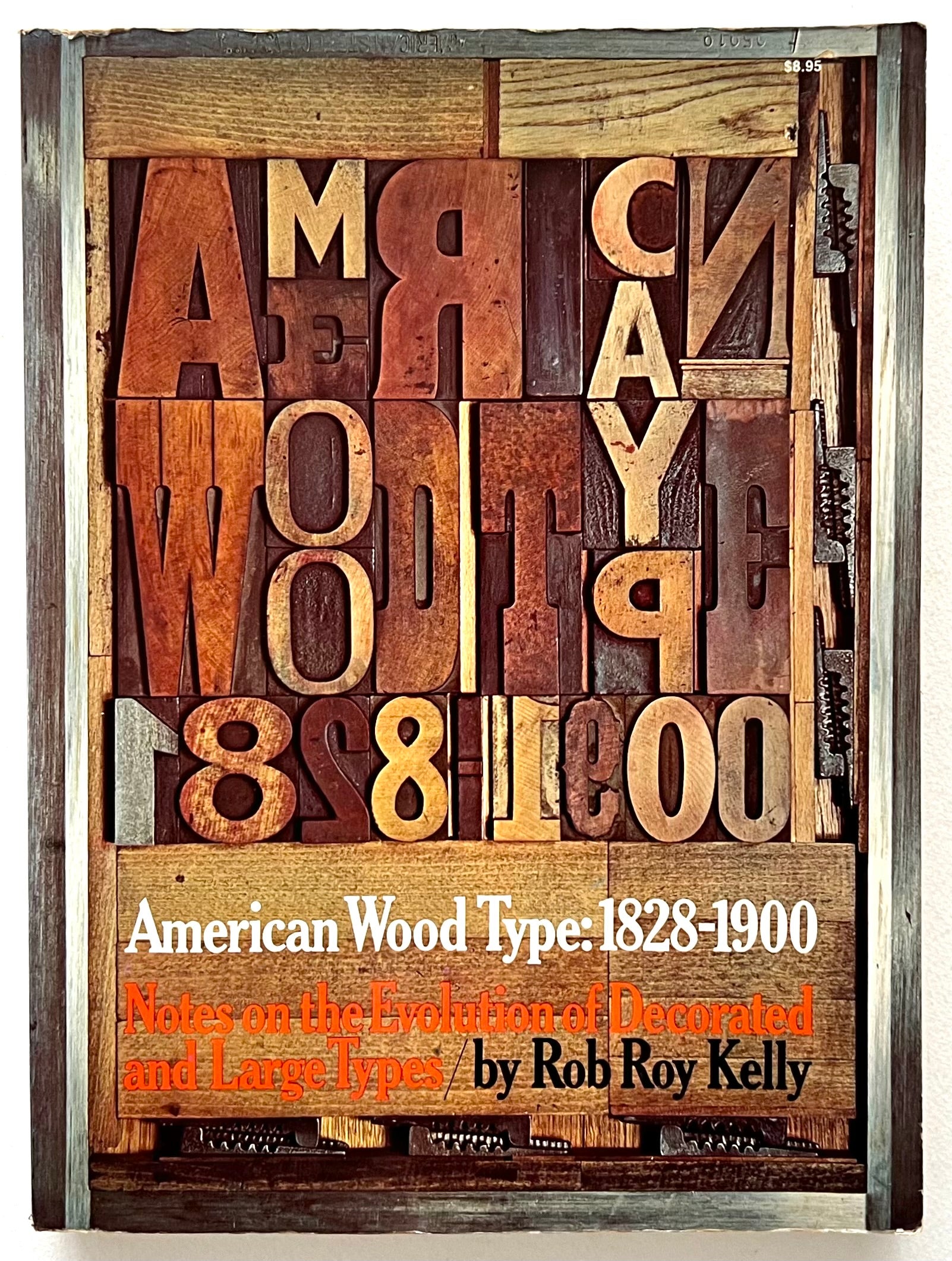 Book cover with wooden letters and text 'American Wood Type: 1828-1900' by Rob Roy Kelly.