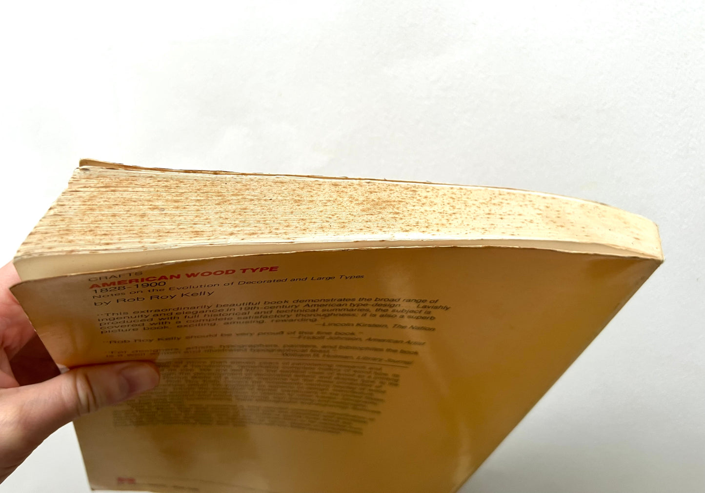 Close-up of a book with text on a white background 'American Wood Type: 1828-1900' by Rob Roy Kelly.