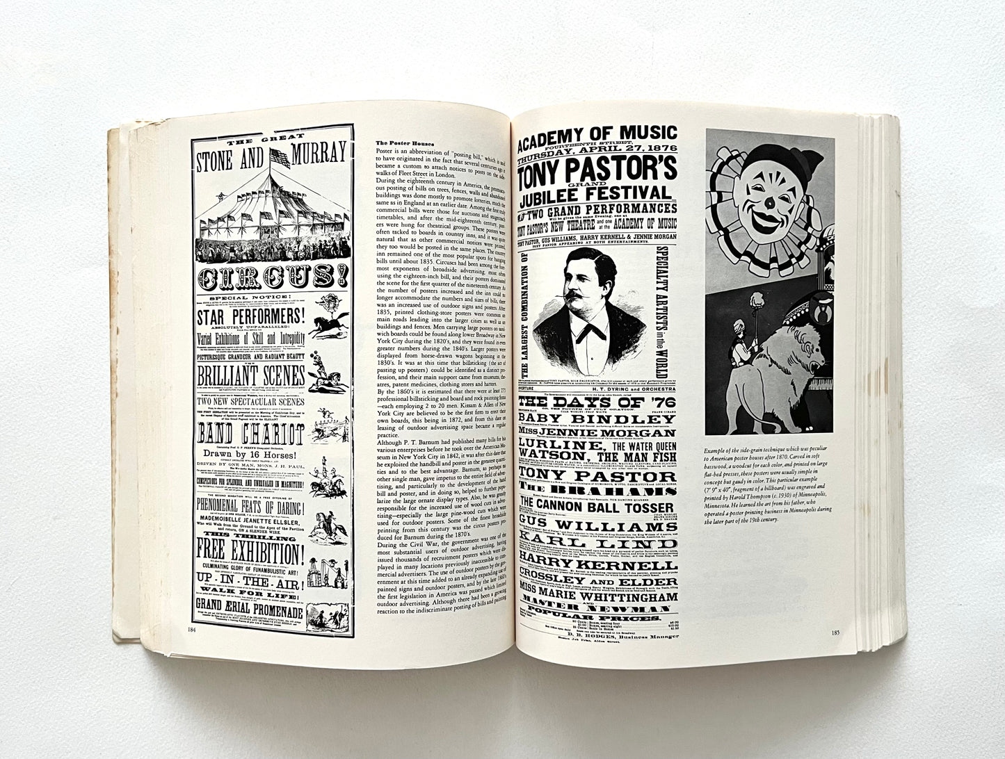 Open book with black and white text and images on a white background