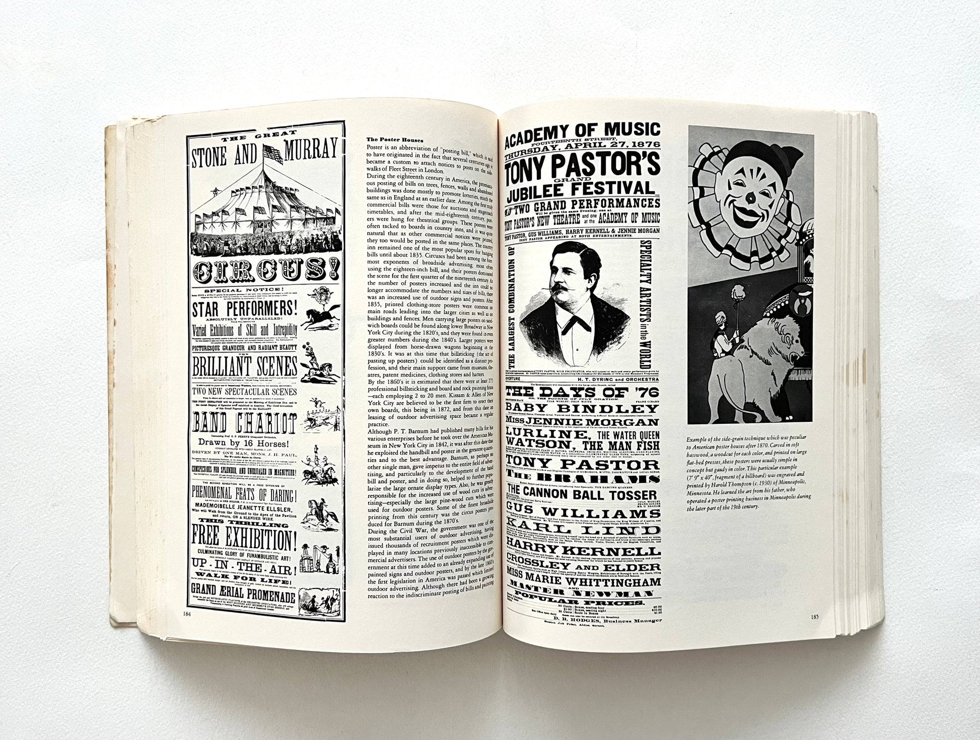 Open book with black and white text and images on a white background