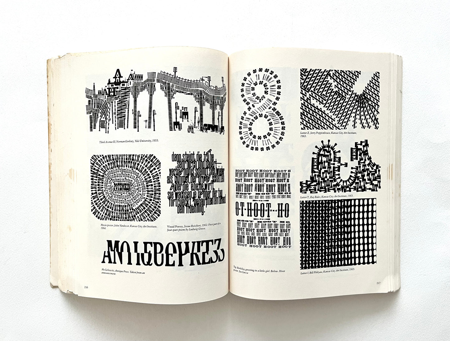 Open book displaying black and white geometric patterns and text on a white background