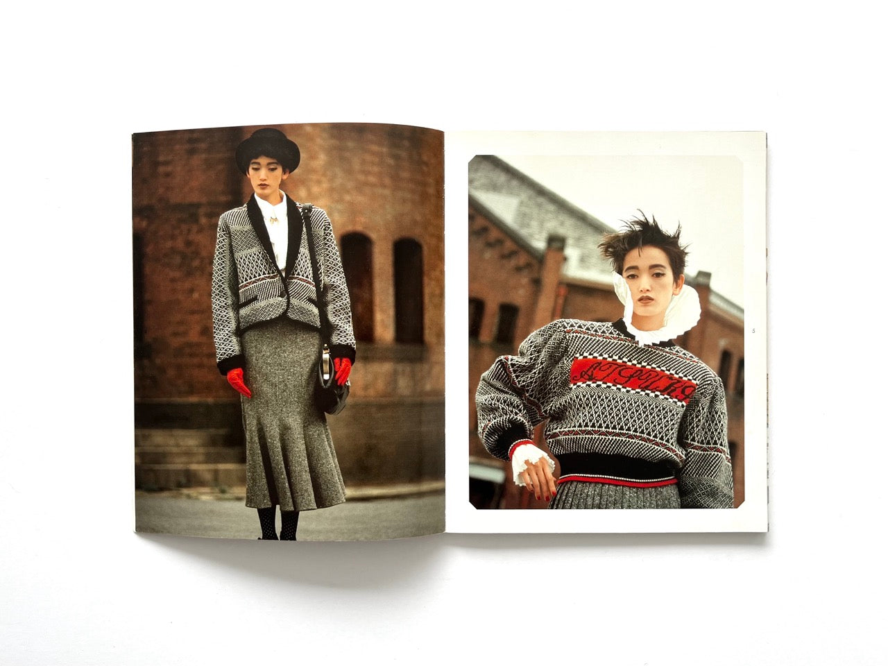 Interior spread from Atsuki Onishi's Knit Picture Book, published in 1989, showcasing two editorial fashion portraits featuring patterned knitwear, tailored silhouettes and striking red accessories.