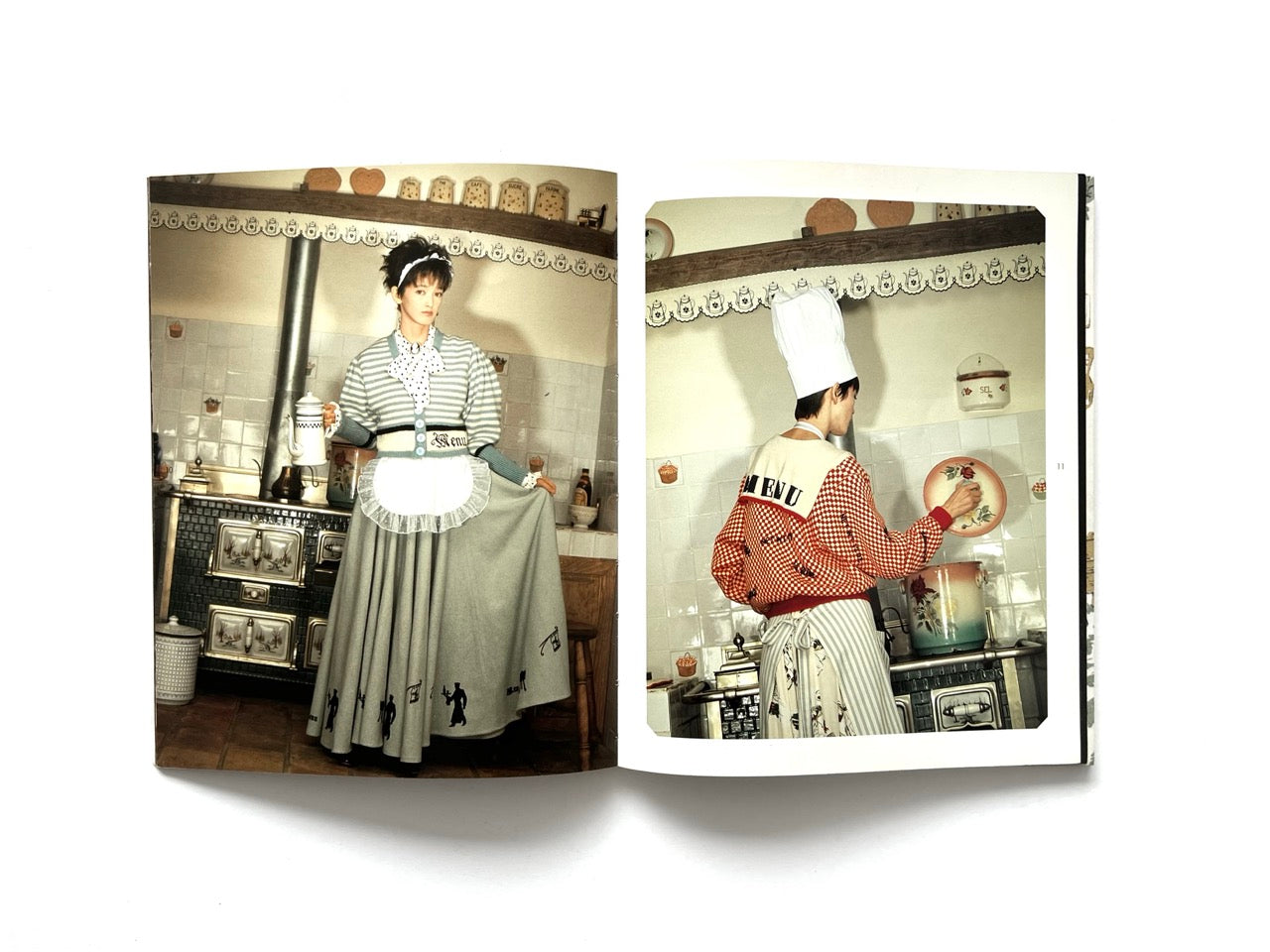 Interior spread from Atsuki Onishi's Knit Picture Book, published in 1989, featuring playful fashion photography of knitwear styled with aprons and chef-inspired accessories in a vintage kitchen.
