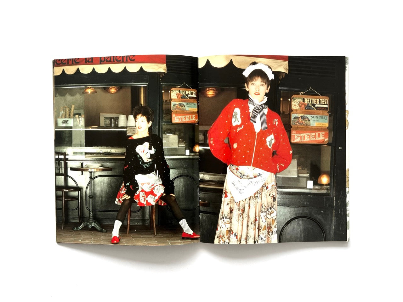 Interior spread from Atsuki Onishi's Knit Picture Book, published in 1989, showcasing colourful knit cardigans and printed skirts styled in a Parisian café setting.