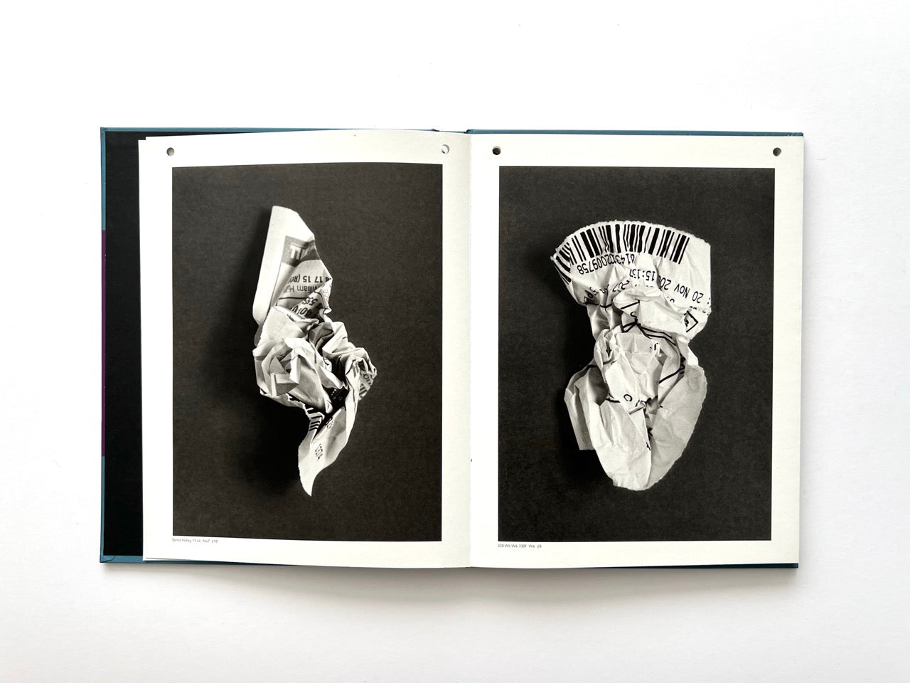 Interior spread from A Series of Disappointments (2008) by Stephen Gill, featuring discarded betting slips  against dark backgrounds.