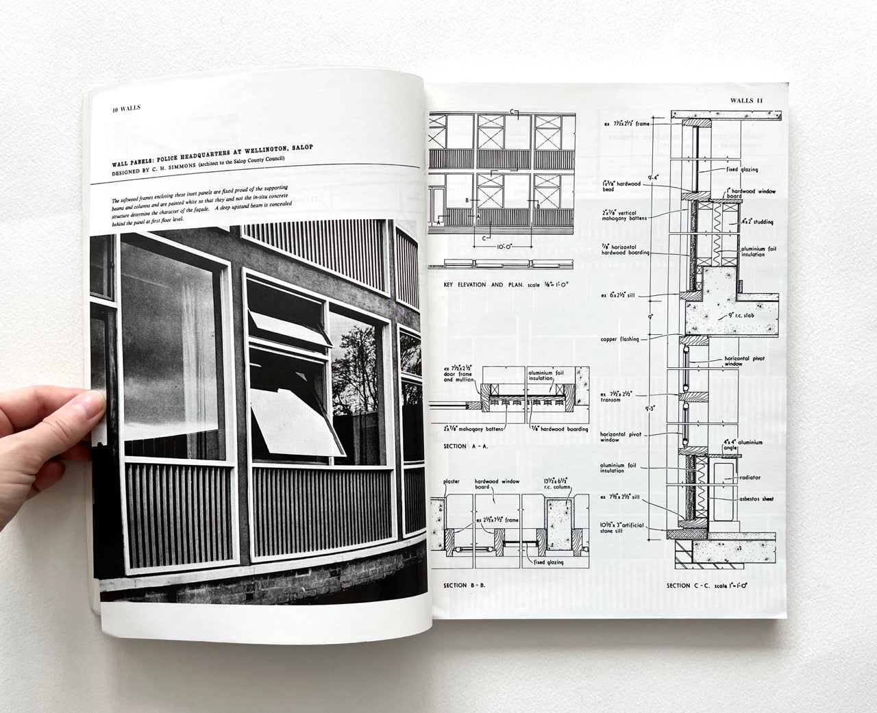 Open book - BEST OF ARCHITECTS’ WORKING DETAILS - VOLUME 1: EXTERNAL - showing b&w photograph of a modern building facade and an architectural drawing.