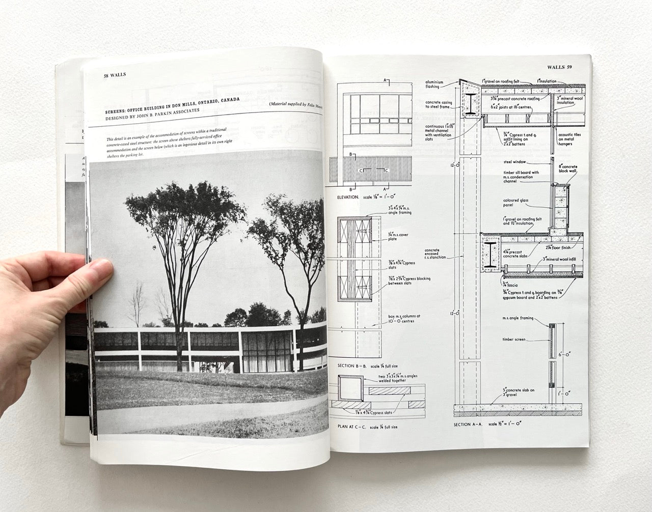 Open book - BEST OF ARCHITECTS’ WORKING DETAILS - VOLUME 1: EXTERNAL - showing b&w photograph of a modern building and an architectural drawing.