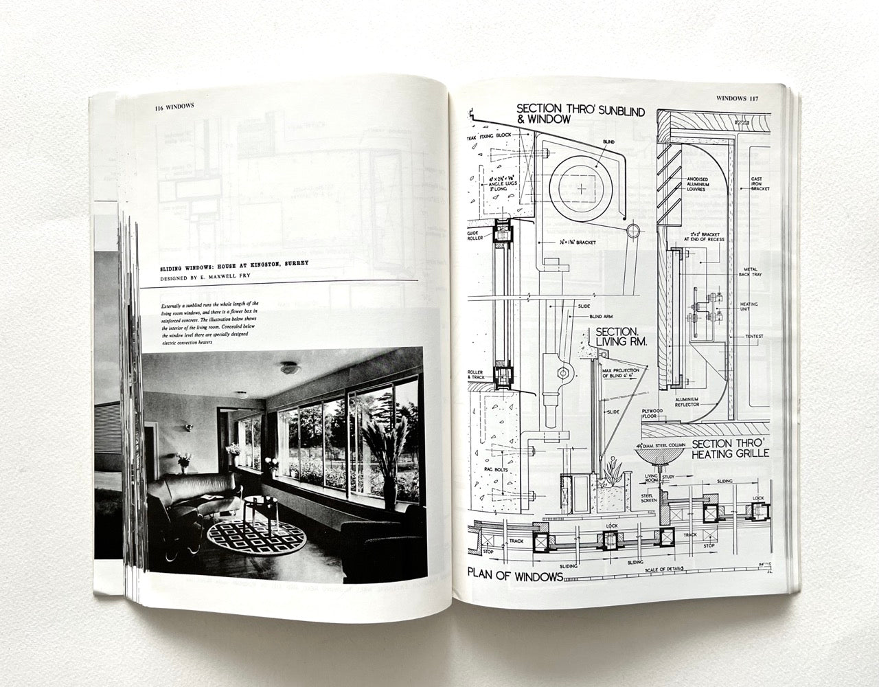 Open book - BEST OF ARCHITECTS’ WORKING DETAILS - VOLUME 1: EXTERNAL - showing b&w photograph of a modernist interior and an architectural drawing.
