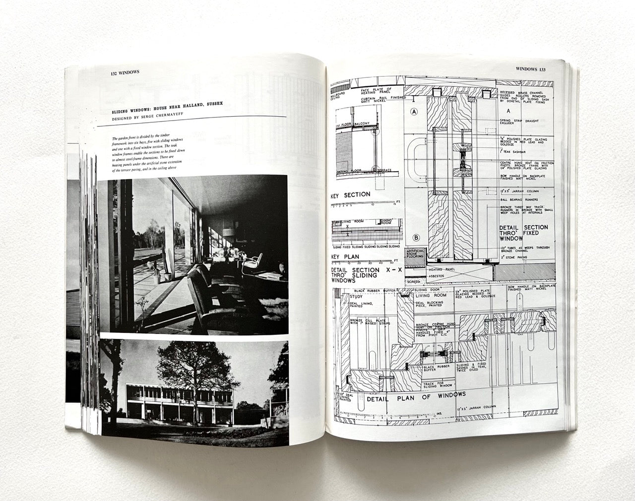 Open book - BEST OF ARCHITECTS’ WORKING DETAILS - VOLUME 1: EXTERNAL - showing b&w photograph of a modern building, its interior and an architectural drawing.