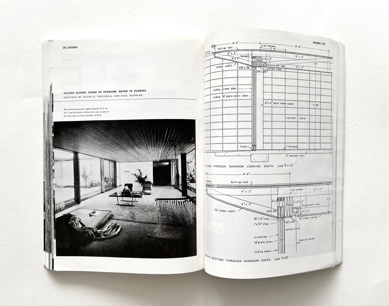 Open book - BEST OF ARCHITECTS’ WORKING DETAILS - VOLUME 1: EXTERNAL - showing b&w photograph of a minimalist interior and an architectural drawing.