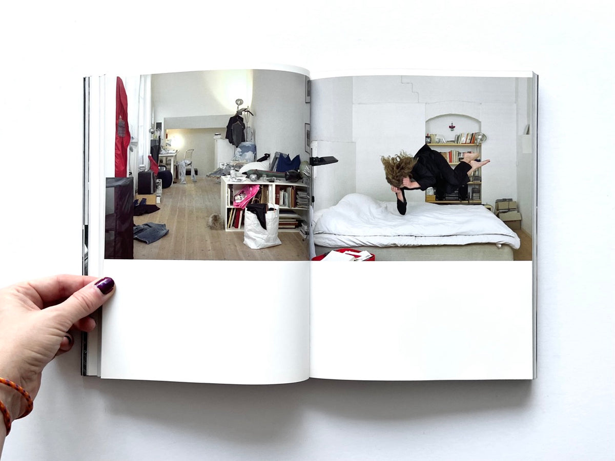 BLESS: Celebrating 10 Years of Themelessness by Désirée Heiss and Ines Kaag, 2006. Colour interior spread showing a cluttered studio apartment and a staged photograph of a person suspended horizontally above a bed.