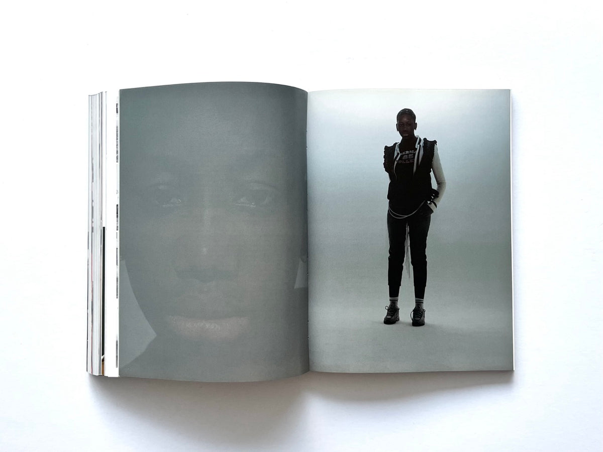 BLESS: Celebrating 10 Years of Themelessness by Désirée Heiss and Ines Kaag, 2006. Minimalist double-page spread featuring a full-length fashion portrait of a model in layered black clothing, alongside a faint monochrome close-up portrait.