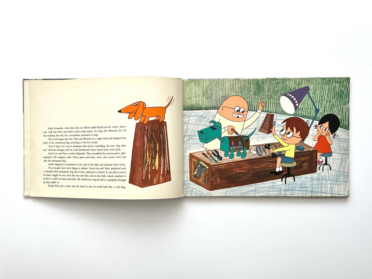 Brownie and the Mechanical Dog by György Várnai, 1976 – illustrated workshop scene where children and an inventor assemble a mechanical dog.